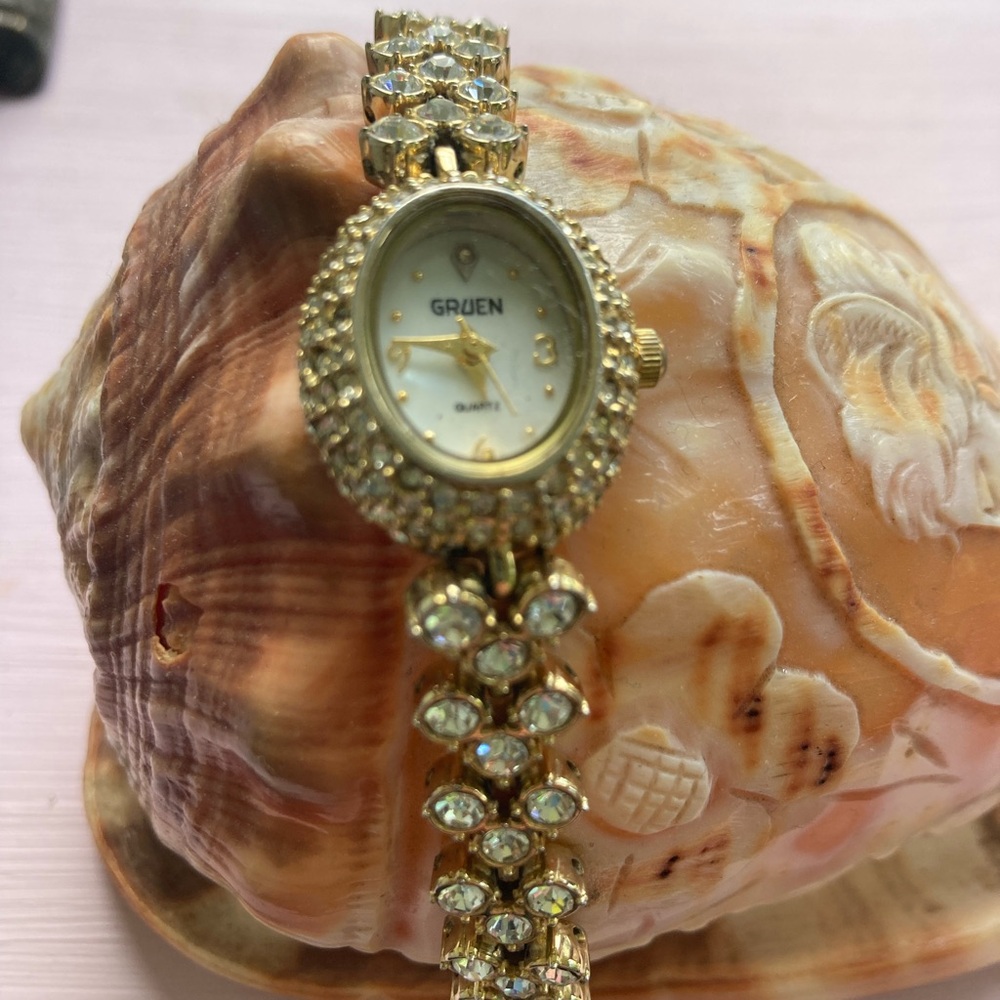 Gold and White Vintage-Style Watch with Crystal Accents